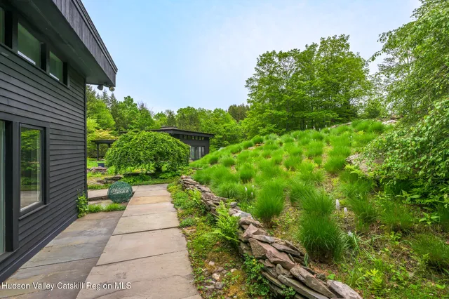 a backyard of a house with a garden