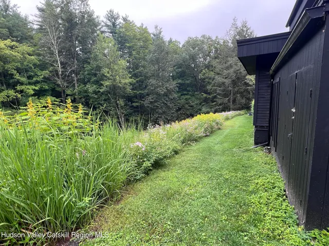 a view of a road with a yard