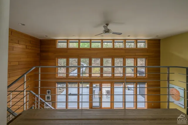 a living room with furniture and a lamp