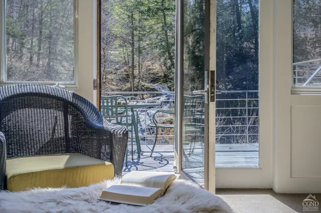 a room with gym equipment and wooden floor