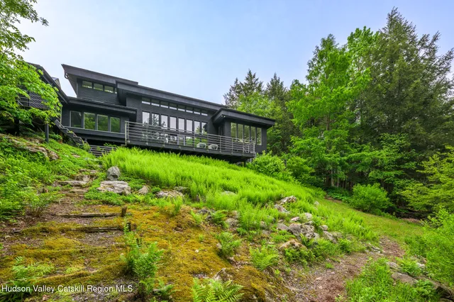 a backyard of a house with lots of green space