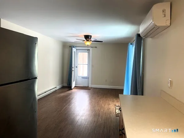 a view of a livingroom with wooden floor