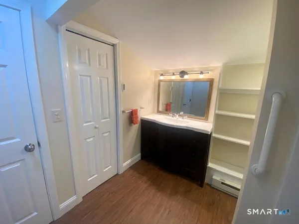 a en suite bathroom with a sink and a mirror
