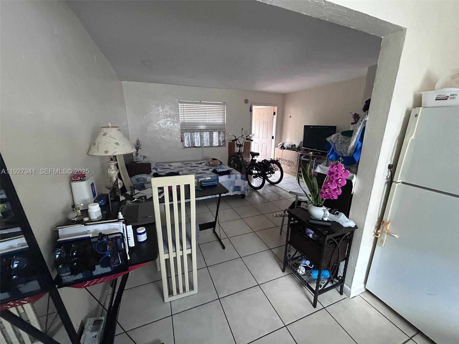 6124 Pembroke Road, Unit 18 Miramar, FL 33023 - Photo 18 of 20 a view of a livingroom with furniture and a window