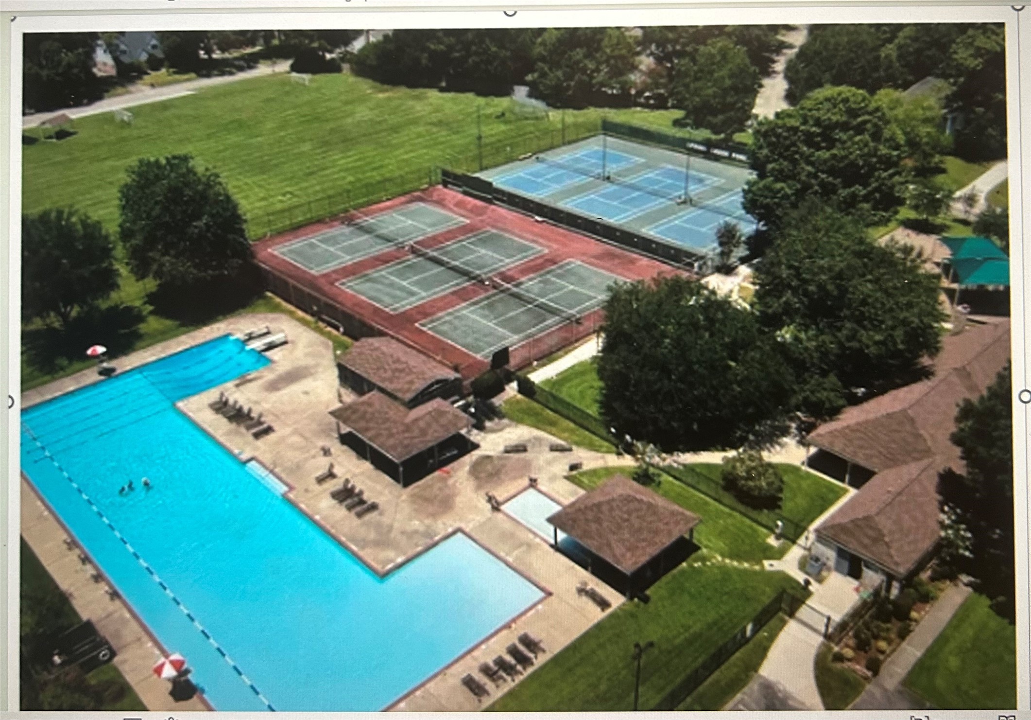6710 Falling Waters Drive Spring, TX 77379 - Photo 38 of 39 Beautiful Olympic sized pool, a clubhouse, 5 tennis courts, 4 pickleball courts, a covered playground, a little library, a baseball field, soccer field, park and nearby trails!