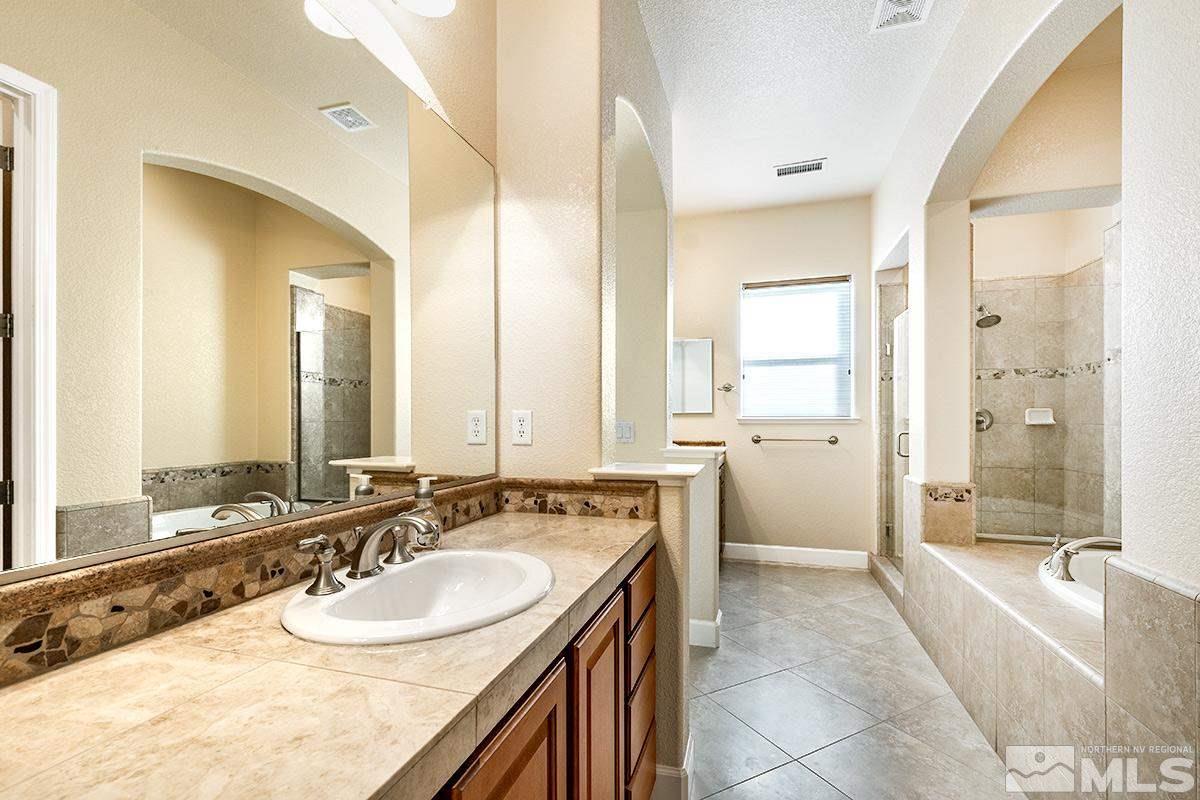 10190 Gold Mine Drive Reno, NV 89521 - Photo 20 of 25 a spacious bathroom with a sink double vanity and a mirror