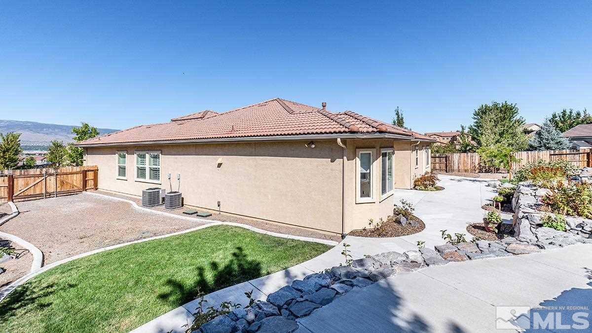 10190 Gold Mine Drive Reno, NV 89521 - Photo 23 of 25 a view of a house with a yard