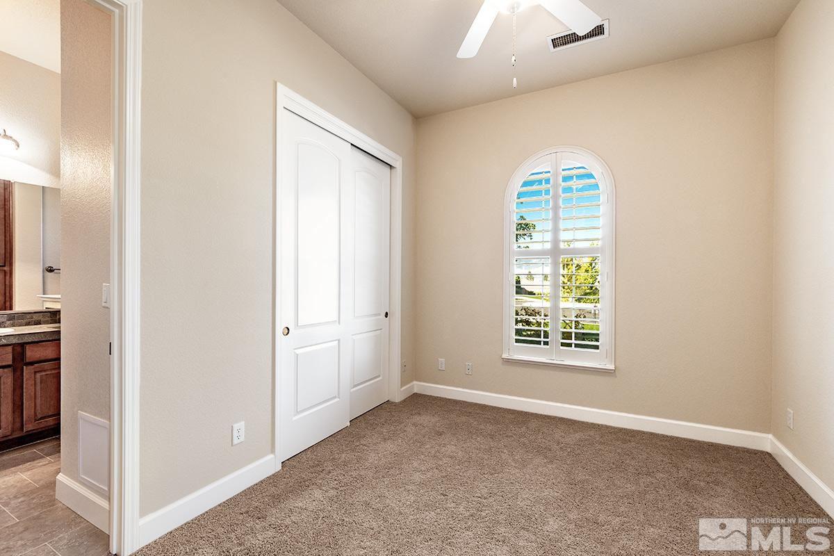 10190 Gold Mine Drive Reno, NV 89521 - Photo 5 of 25 an empty room with windows and closet