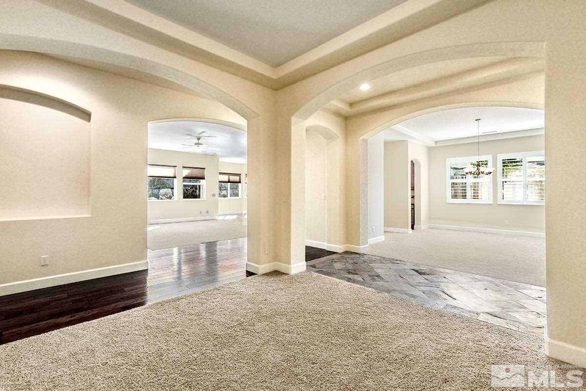 10190 Gold Mine Drive Reno, NV 89521 - Photo 7 of 25 a view of a livingroom with wooden floor and windows