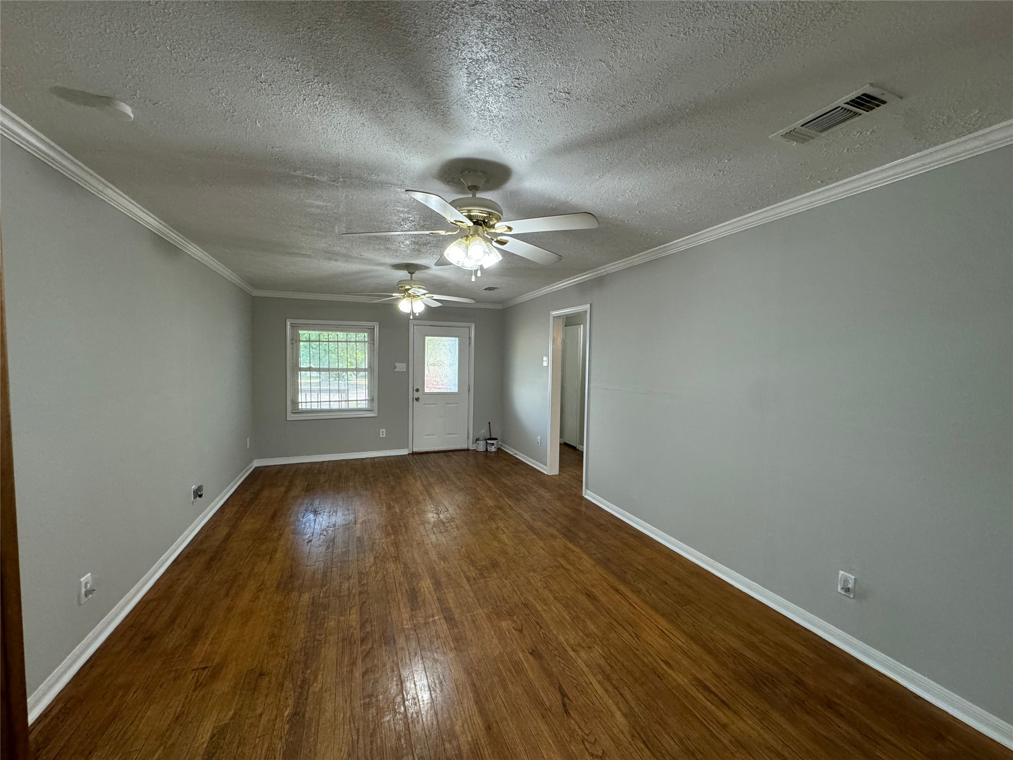 125 Pomeroy Street Pasadena, TX 77506 - Photo 10 of 19 wooden floor in an empty room with a window