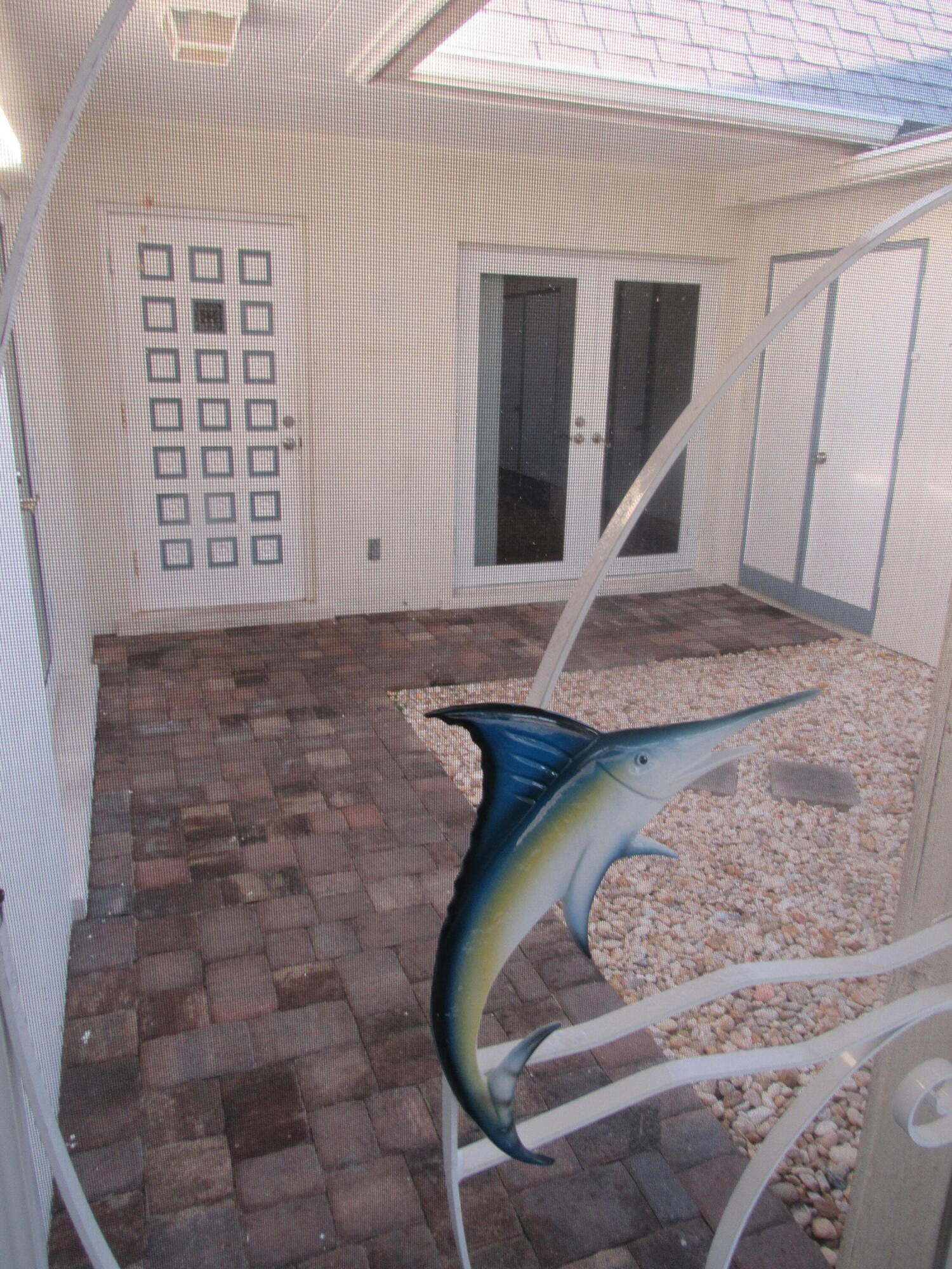 15 Sailfish Lane Ocean Ridge, FL 33435 - Photo 2 of 10 15 Sailfish-entry courtyard (1)