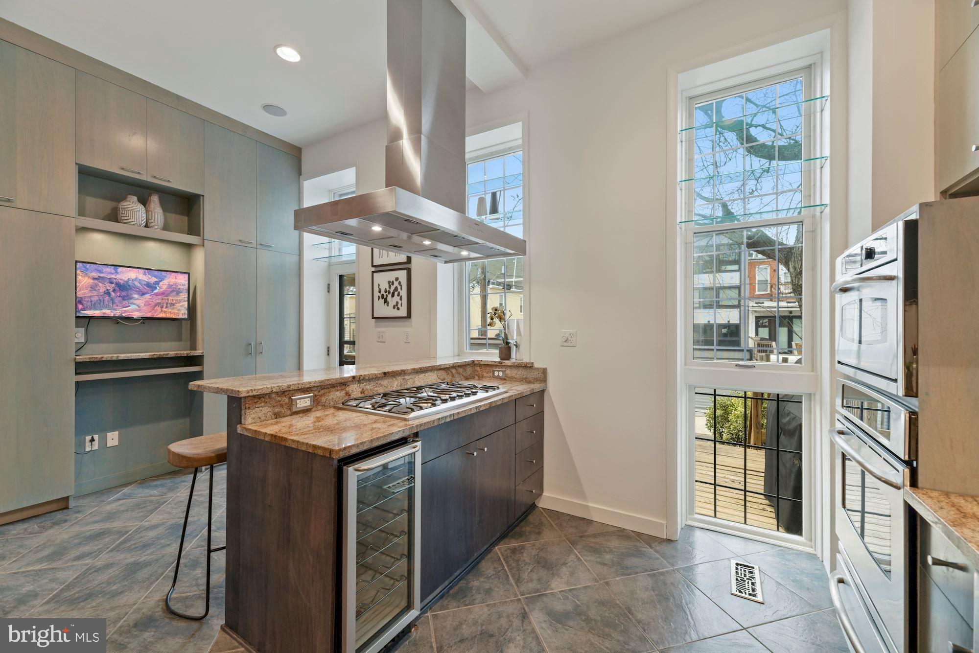 1313 Riggs Street Northwest Washington, DC 20009 - Photo 5 of 35 Sunny Kitchen with Custom Built-ins
