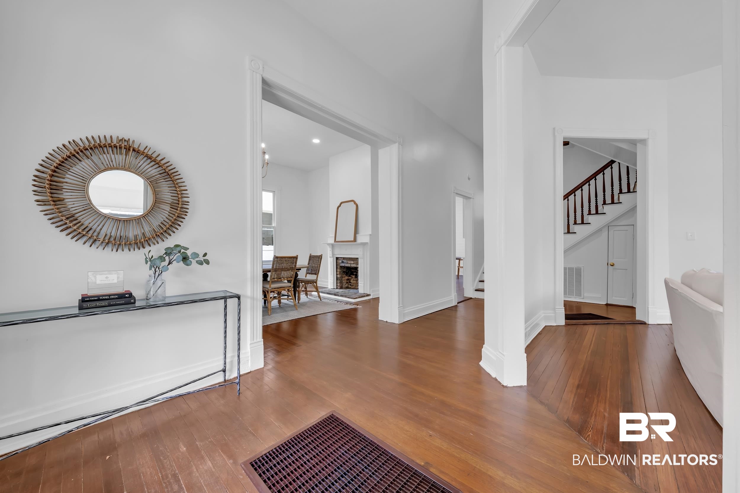1662 Government Street Mobile, AL 36604 - Photo 5 of 33 Foyer entrance featuring dark wood-type flooring, a fireplace with raised hearth, stairs, and recessed lighting