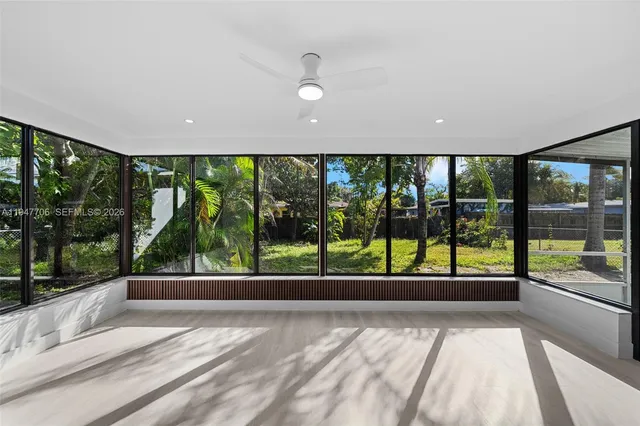 a large kitchen with stainless steel appliances kitchen island granite countertop a sink and cabinets