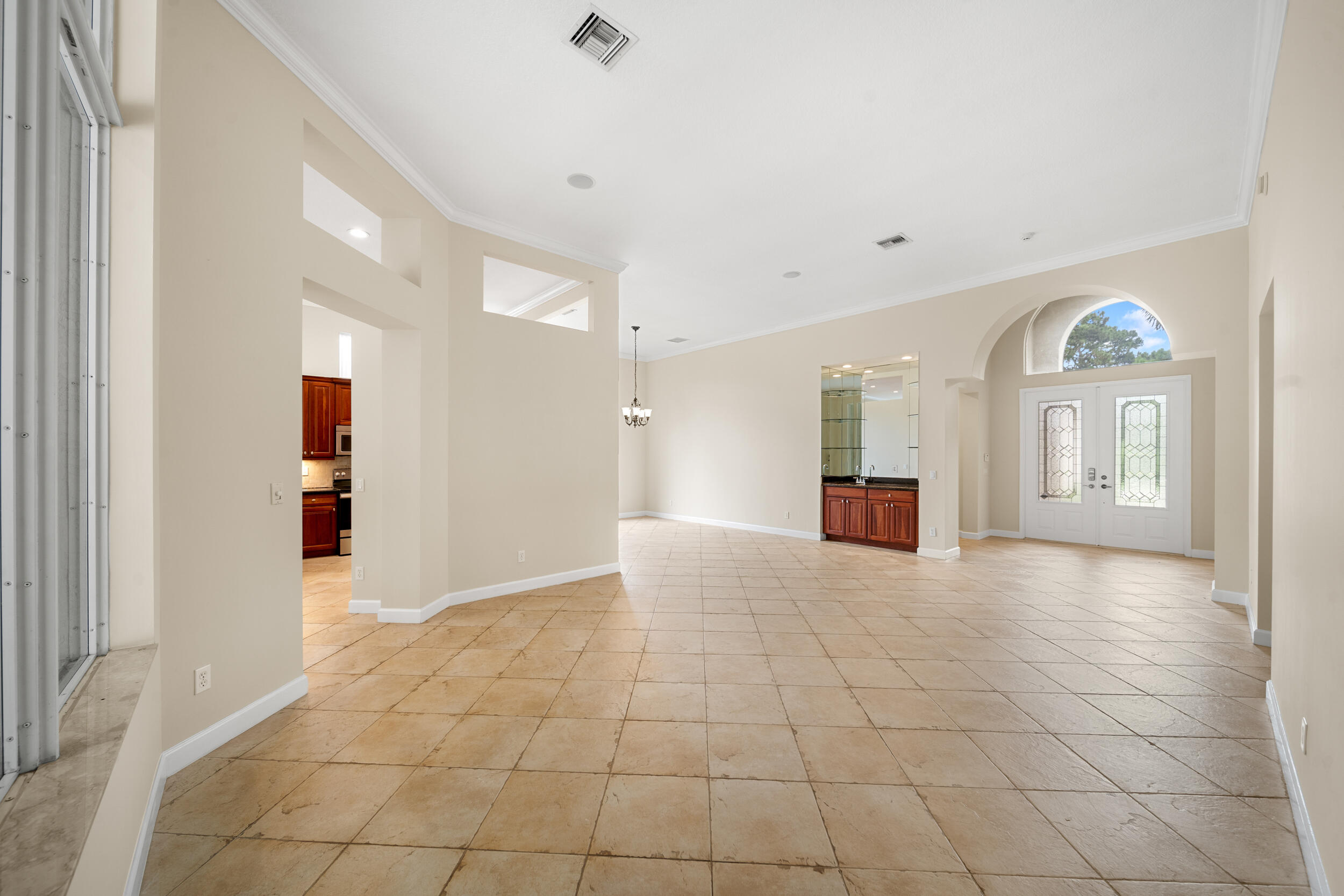 9004 Pumpkin Ridge Port St. Lucie, FL 34986 - Photo 15 of 36 a view of a hallway with wooden shelves