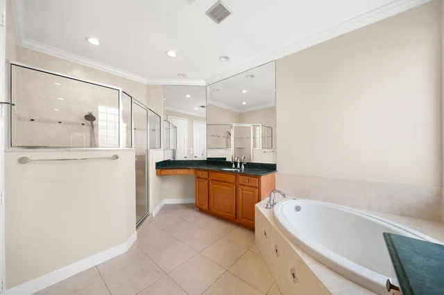 a large kitchen with a sink a refrigerator and a stove