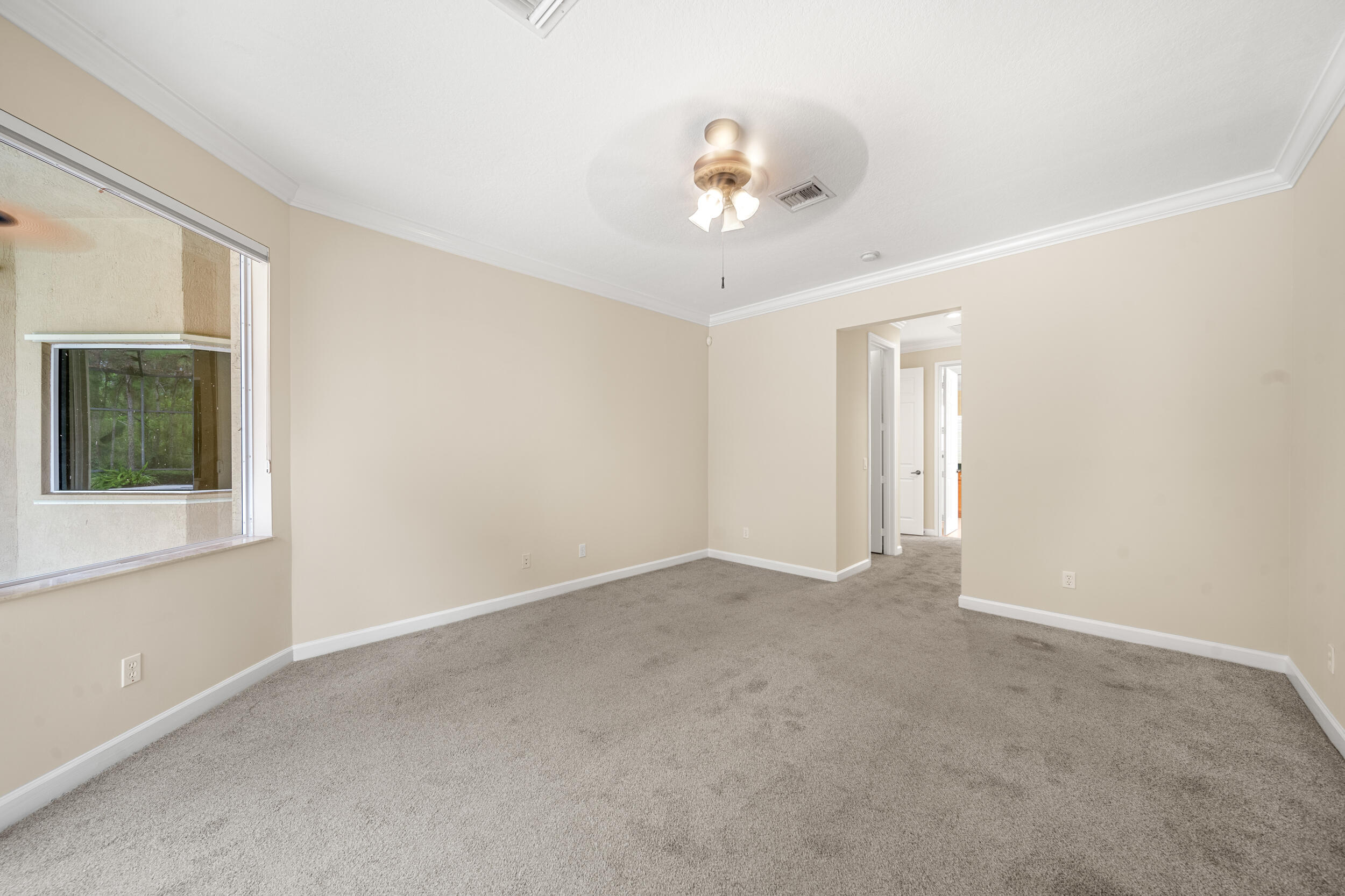 9004 Pumpkin Ridge Port St. Lucie, FL 34986 - Photo 23 of 36 a view of an empty room with a window