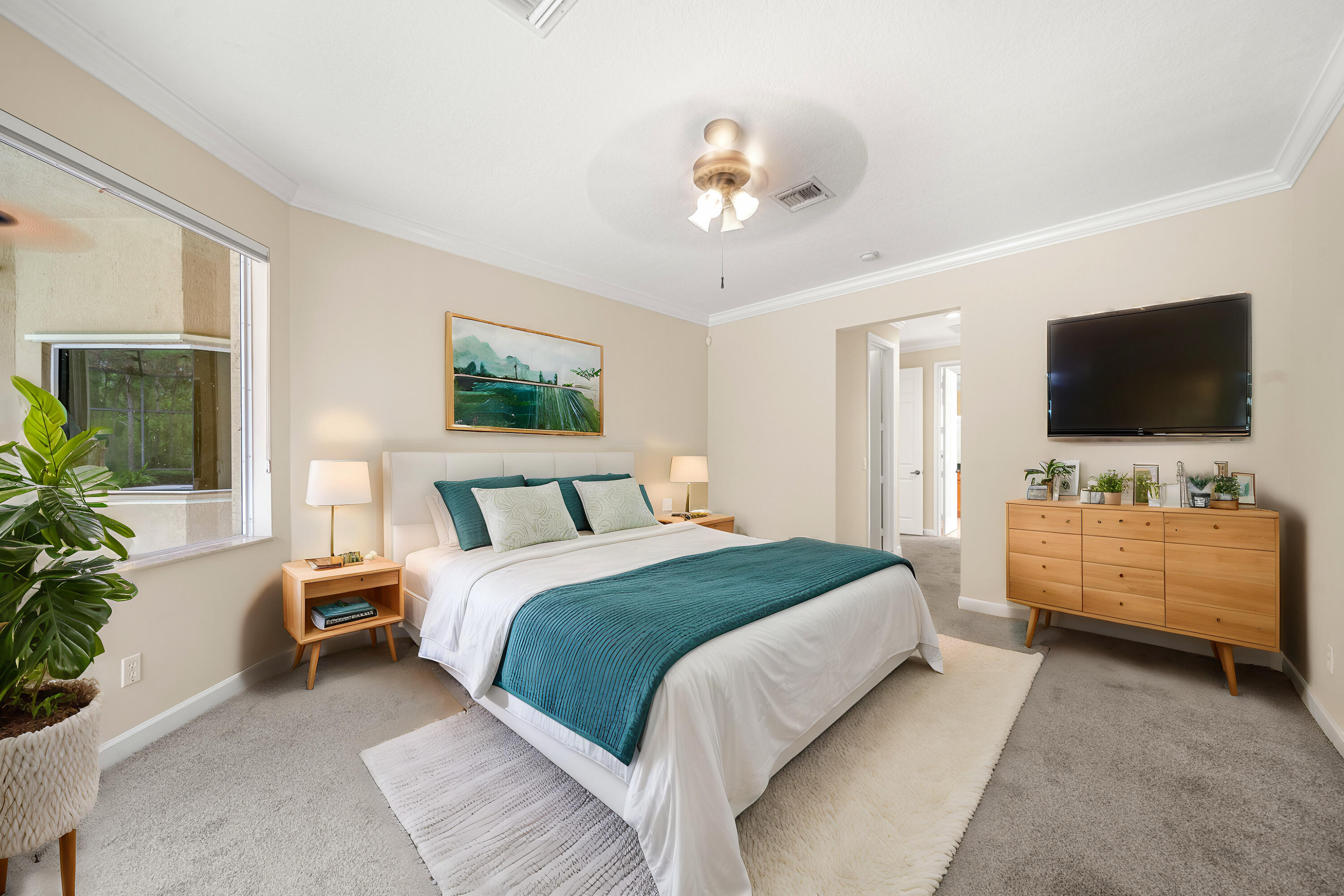 9004 Pumpkin Ridge Port St. Lucie, FL 34986 - Photo 24 of 36 a spacious bedroom with a bed and a flat screen tv