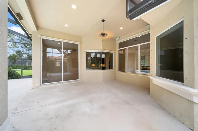 a view of an entryway with a glass door and garden