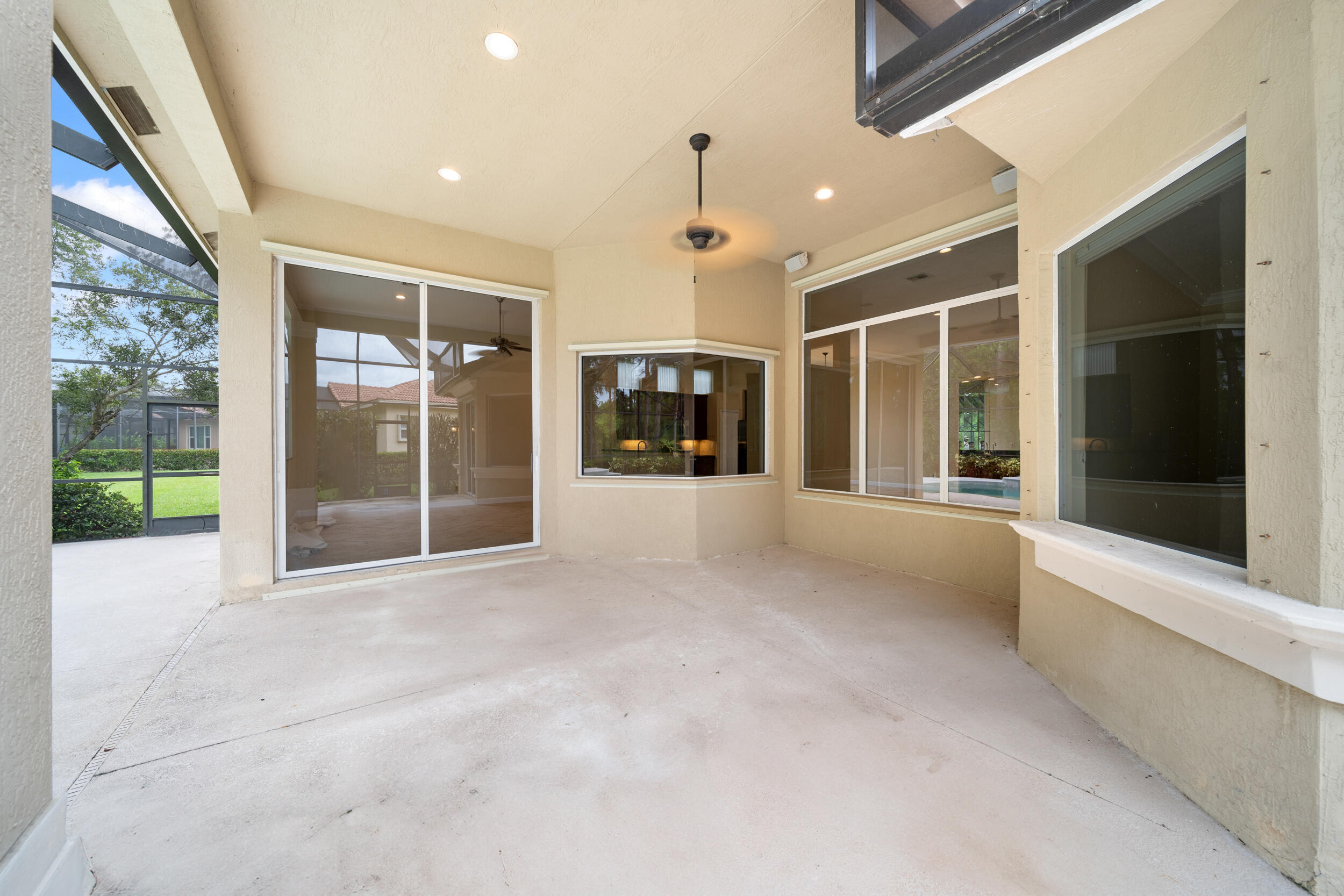 9004 Pumpkin Ridge Port St. Lucie, FL 34986 - Photo 31 of 36 a view of an entryway with a glass door and garden