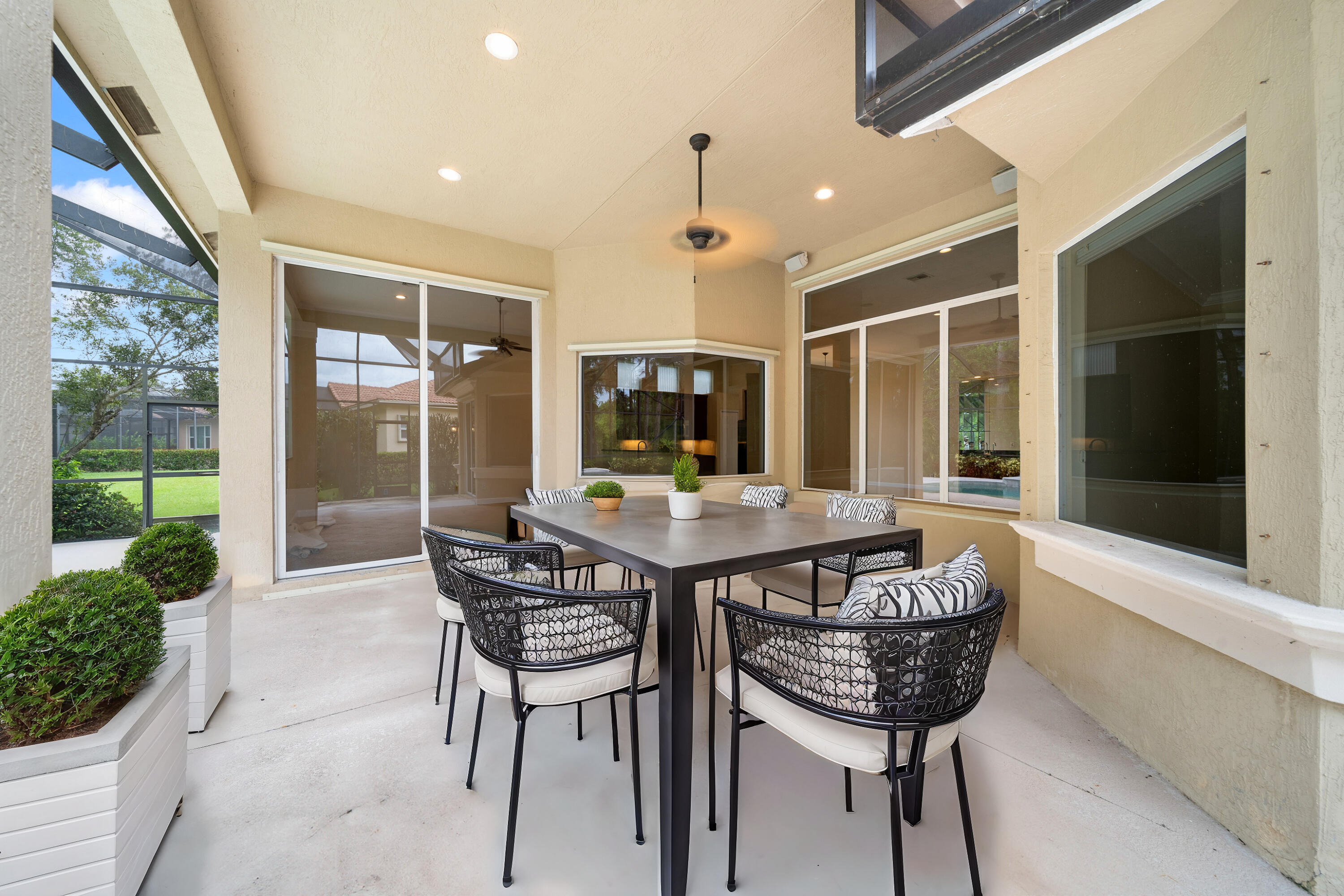 9004 Pumpkin Ridge Port St. Lucie, FL 34986 - Photo 32 of 36 a view of a kitchen with a table and chairs