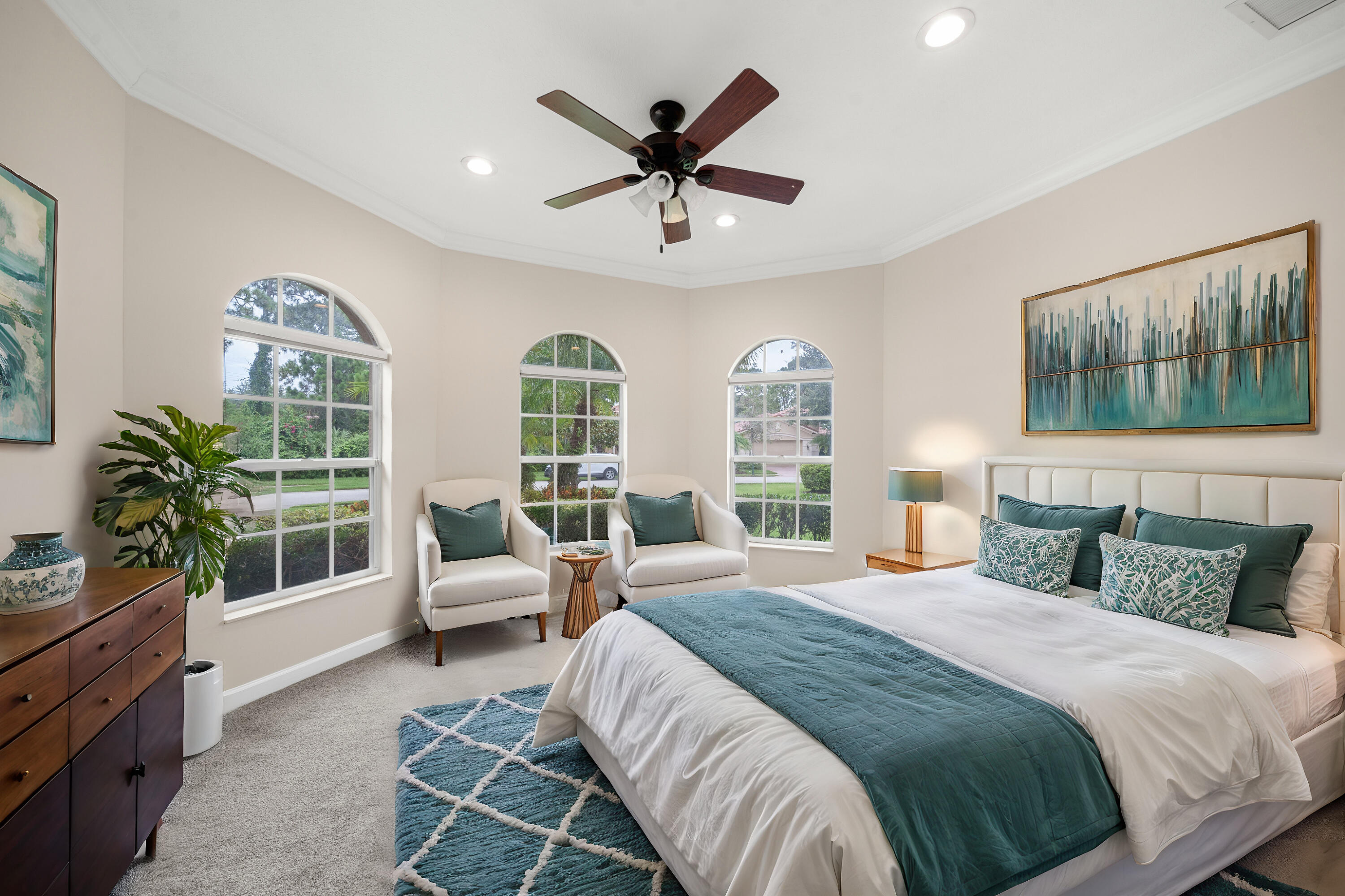 9004 Pumpkin Ridge Port St. Lucie, FL 34986 - Photo 6 of 36 a bedroom with a large bed and a window