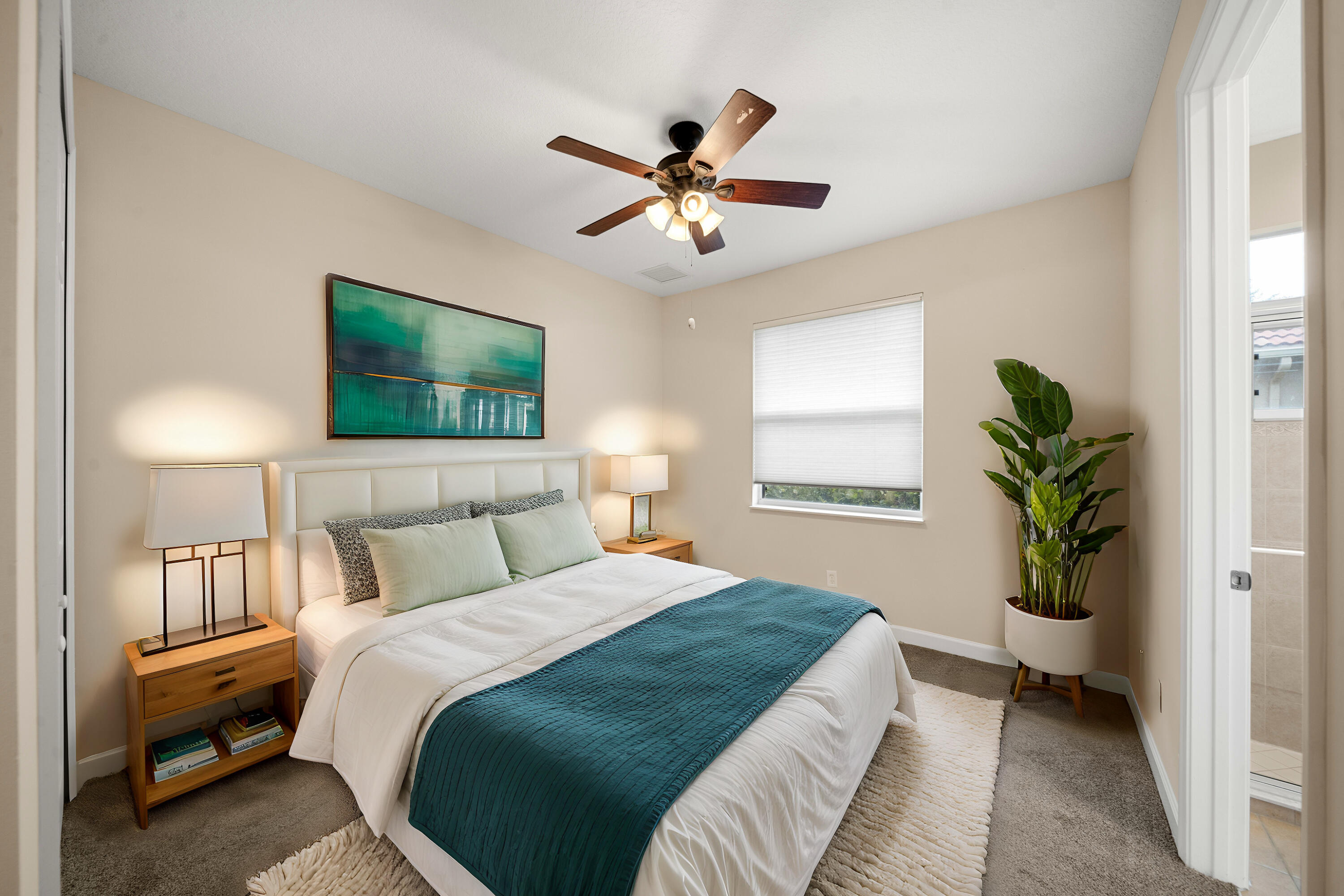 9004 Pumpkin Ridge Port St. Lucie, FL 34986 - Photo 10 of 36 a bedroom with a bed and a chandelier