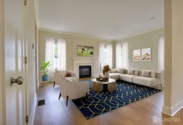 a living room with furniture and a fireplace