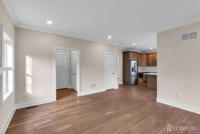 a view of a livingroom with a kitchen