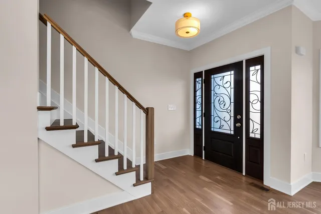 a view of an entryway with wooden floor