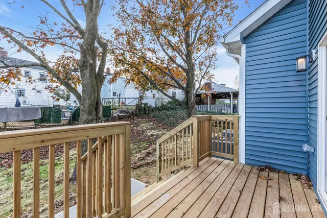 a view of deck with wooden floor and fence