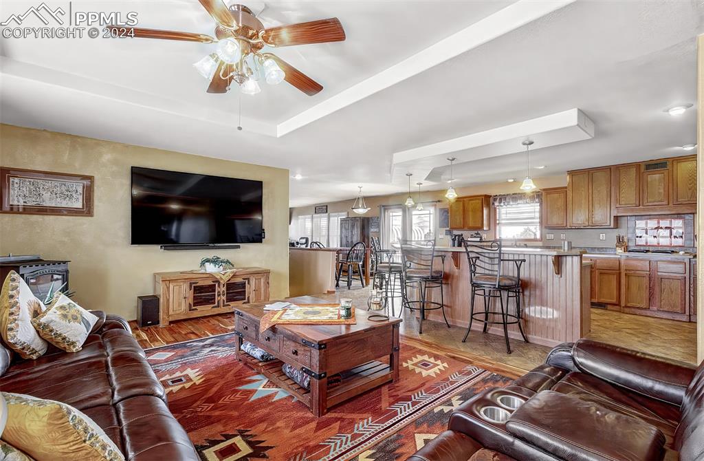747 Harding Road Rush, CO 80833 - Photo 11 of 50 a living room with furniture and a flat screen tv