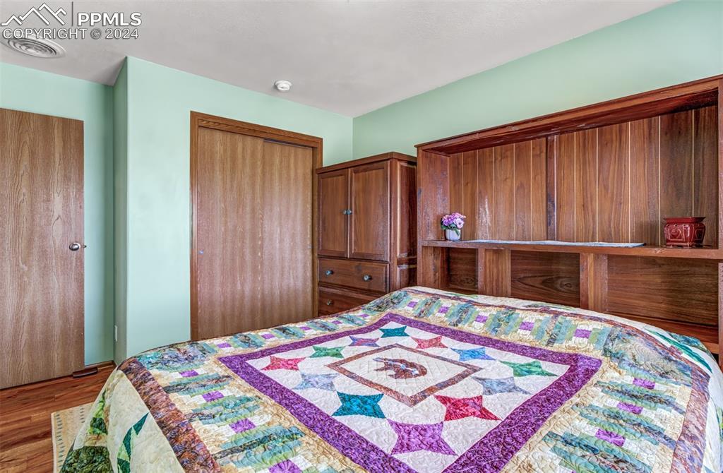 747 Harding Road Rush, CO 80833 - Photo 25 of 50 a bedroom with a bed and a dresser