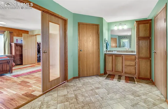 a view of a hallway with a furniture and a livingroom