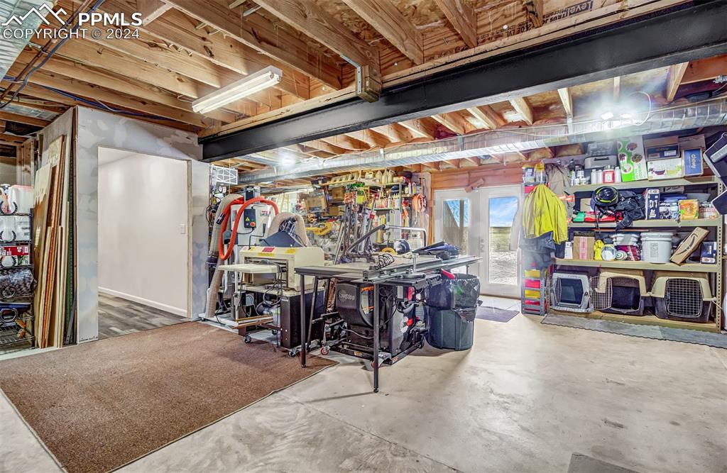 747 Harding Road Rush, CO 80833 - Photo 38 of 50 a view of a storage area with a table and chairs