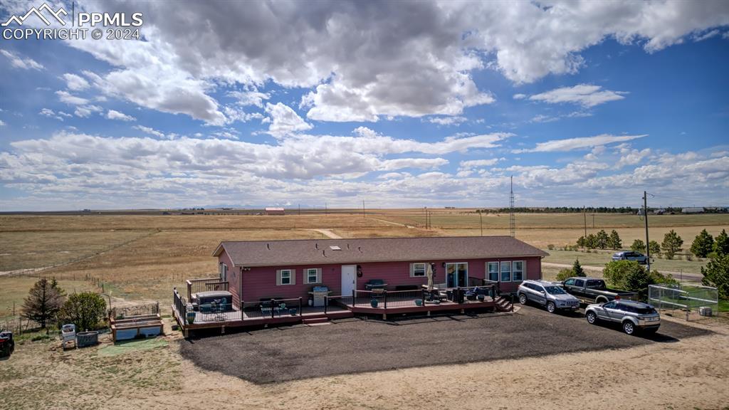 747 Harding Road Rush, CO 80833 - Photo 7 of 50 a view of a building with cars parked