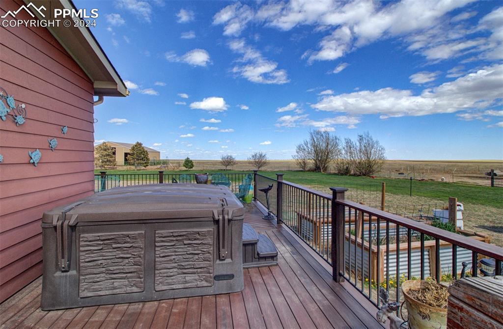 747 Harding Road Rush, CO 80833 - Photo 9 of 50 a view of a balcony with wooden floor & fence
