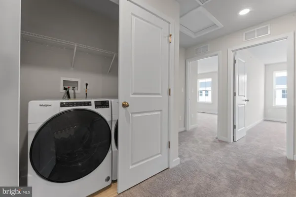 a view of a storage & utility room with washer and dryer