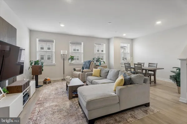 a living room with fireplace furniture and a flat screen tv