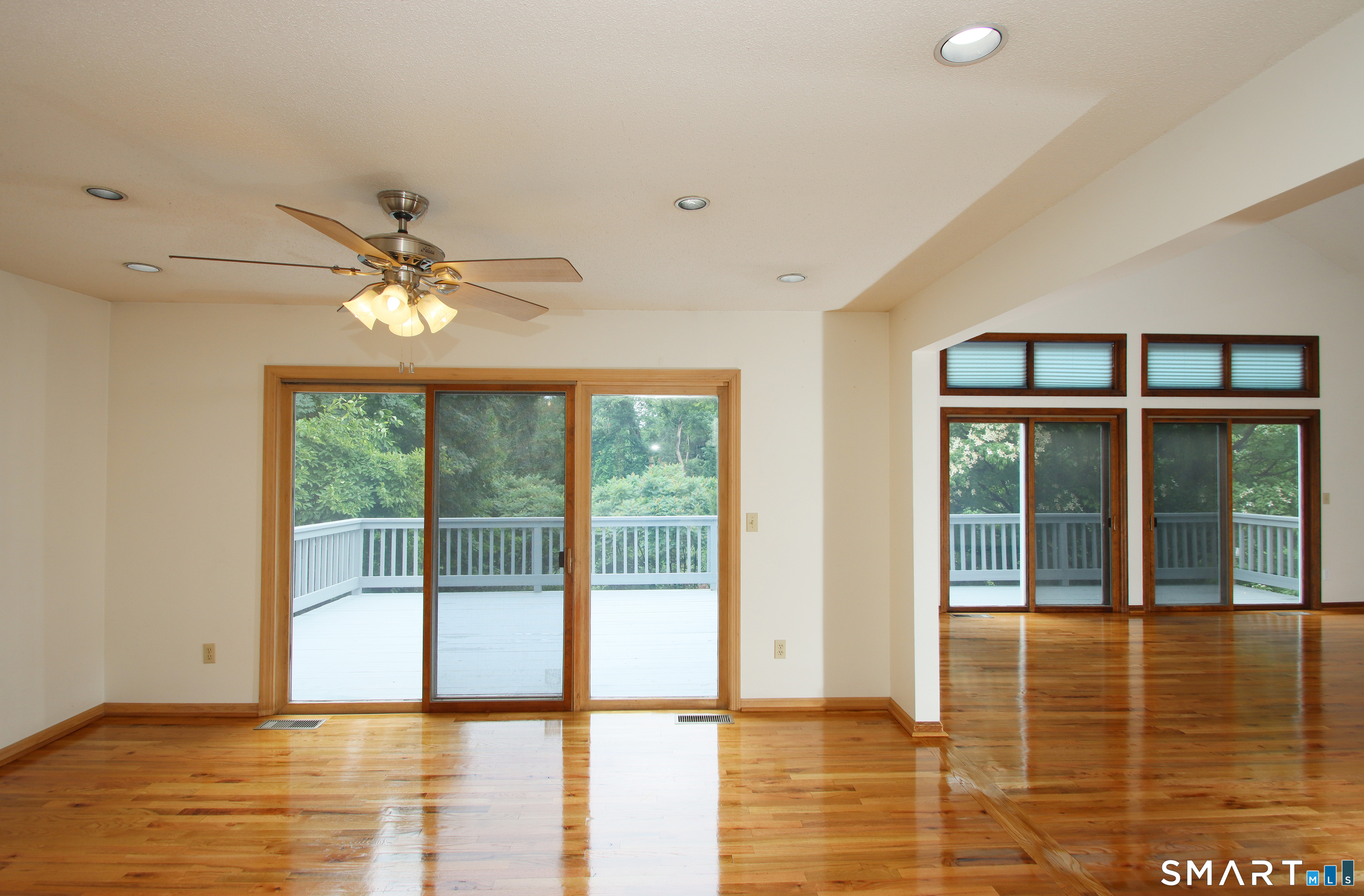 352 Center Street Wolcott, CT 06716 - Photo 14 of 40 a view of an empty room with wooden floor and a window
