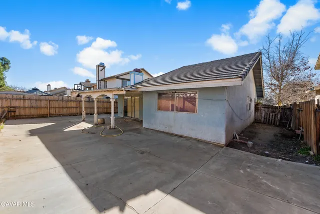 a view of a terrace with wooden fence