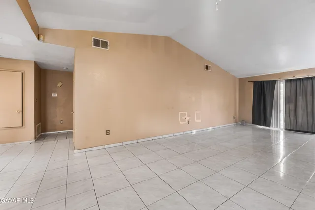 an empty room with white walls