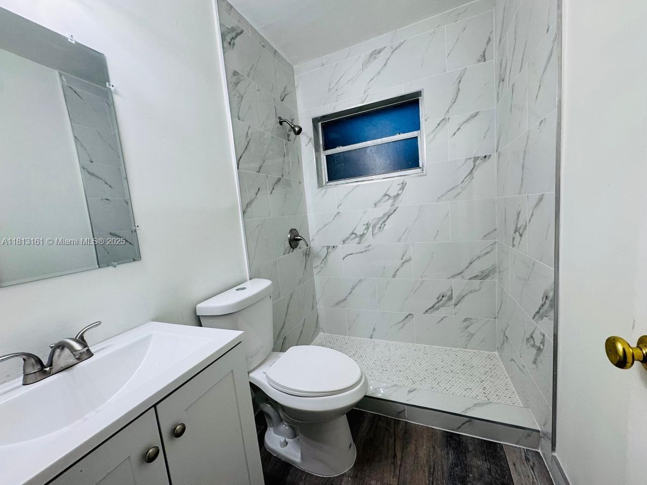 932 Northwest 5th Street, Unit 4 Miami, FL 33128 - Photo 5 of 16 a bathroom with a sink and a toilet