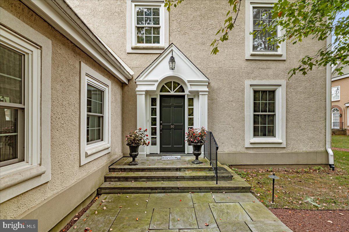 30 Governors Lane Princeton, NJ 08540 - Photo 1 of 1 a front view of a house with a floor to ceiling windows and a rug