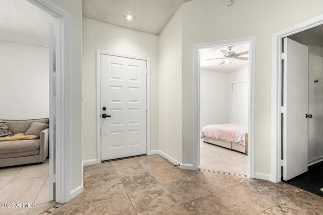 a view of a bedroom with a bed and a couch