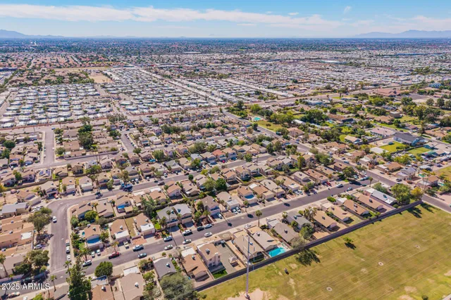 an aerial view of residential building and ocean view