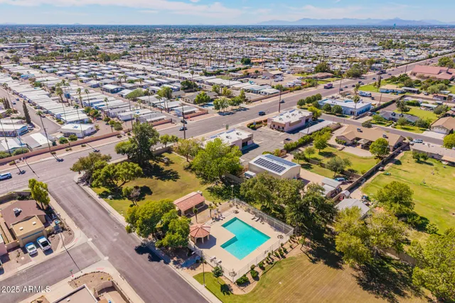 an aerial view of residential houses with outdoor space