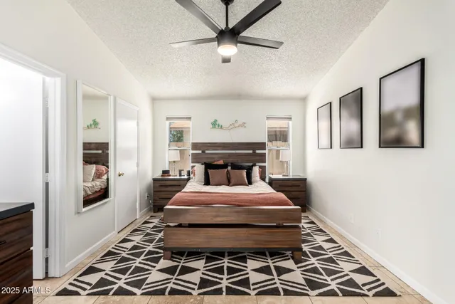 a bed room with a bed and a chandelier