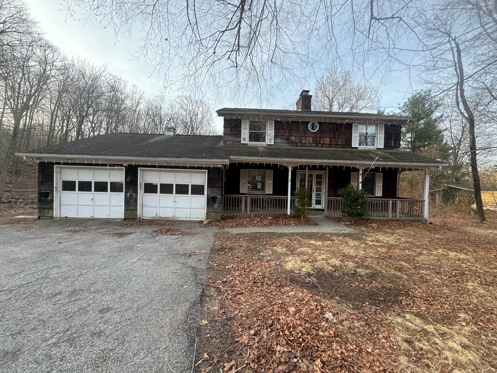 158 Bullet Hole Road Carmel, NY 10512 - Photo 1 of 1 View of front of property featuring a chimney, a porch, a garage, and aphalt driveway