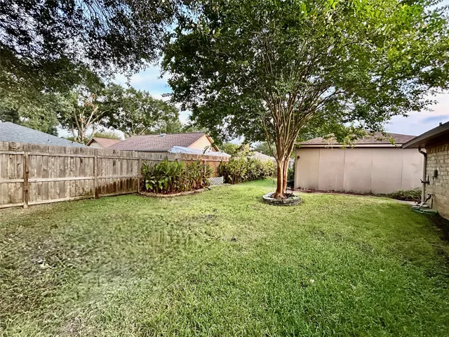 a backyard of a house with lots of green space